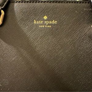 Gently used Kate Spade box purse Small handles and adjustable long strap.